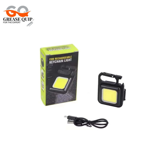 Mini LED Portable Keychain with box and charging cable, compact multifunctional flashlight.